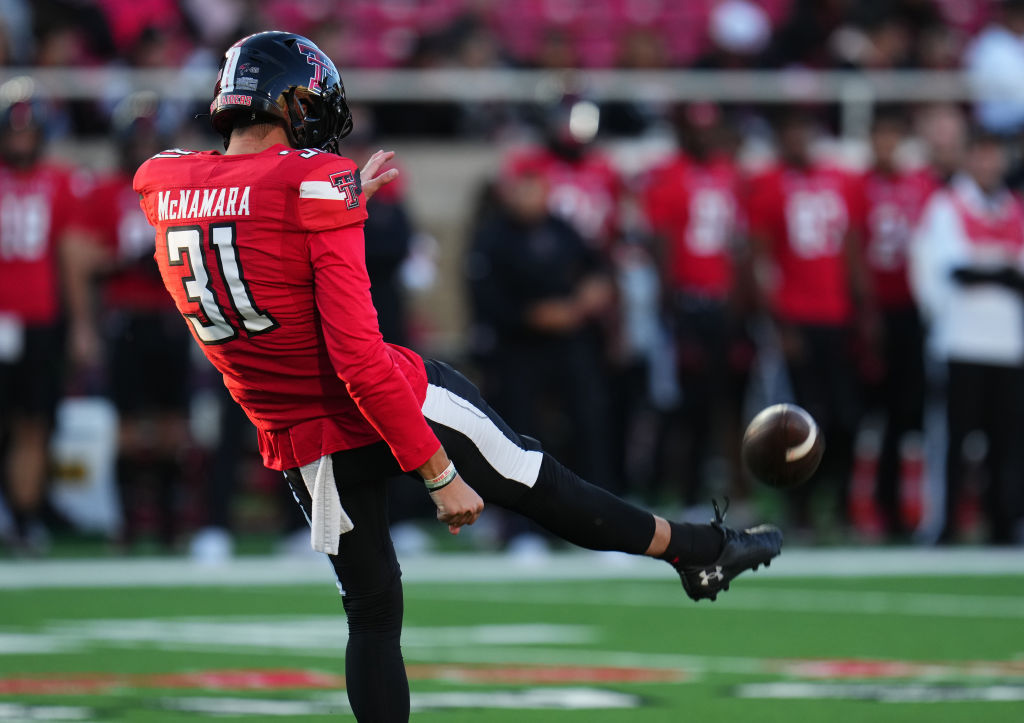 LUBBOCK, TEXAS - NOVEMBER 02: Austin McNamara #31 of the Texas Tech Red Raiders punts during the first quarter of a game against the TCU Horned Frogs at Jones AT&T Stadium on November 02, 2023 in Lubbock, Texas. (Photo by Josh Hedges/Getty Images)