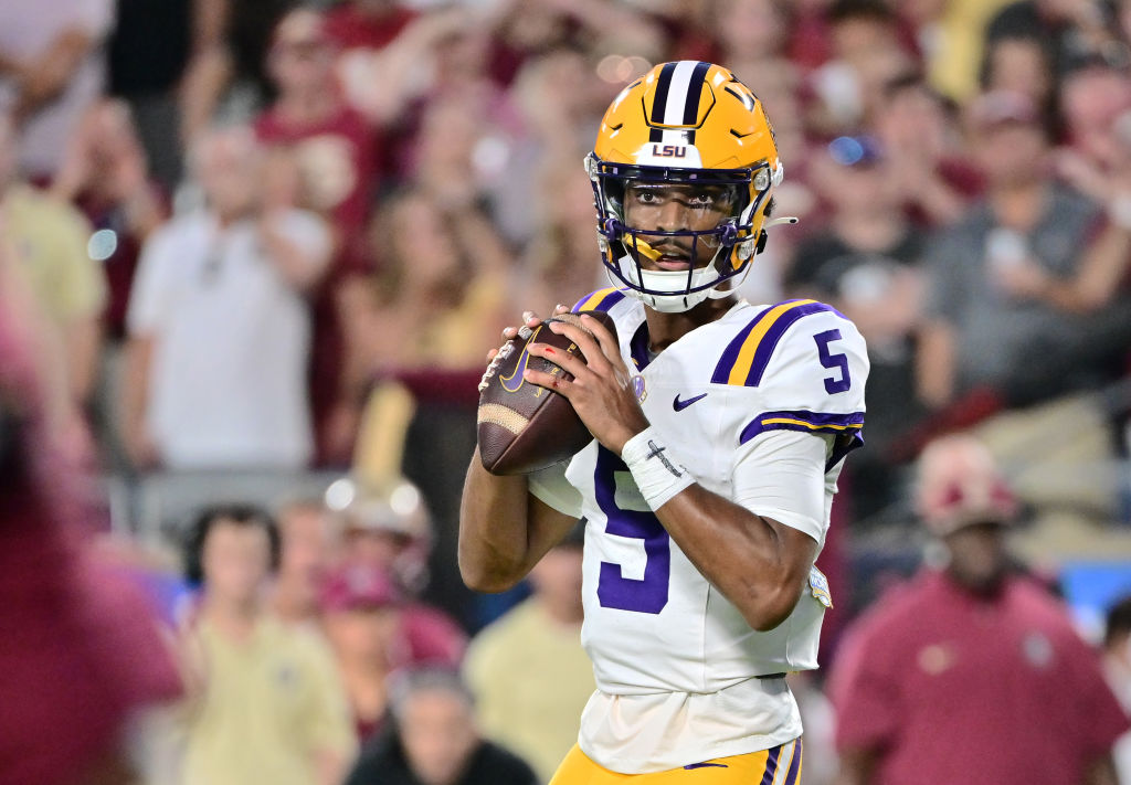 ORLANDO, FLORIDA - SEPTEMBER 03: Jayden Daniels #5 of the LSU Tigers looks to throw a pass in the first half of a game against the Florida State Seminoles at Camping World Stadium on September 03, 2023 in Orlando, Florida. (Photo by Julio Aguilar/Getty Images)