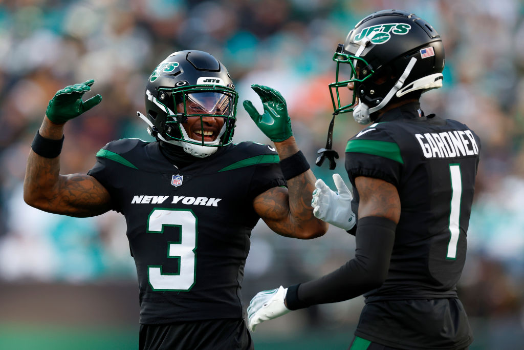 EAST RUTHERFORD, NEW JERSEY - NOVEMBER 24: Jordan Whitehead #3 and Sauce Gardner #1 of the New York Jets react against the Miami Dolphins during the first quarter in the game at MetLife Stadium on November 24, 2023 in East Rutherford, New Jersey. (Photo by Rich Schultz/Getty Images)