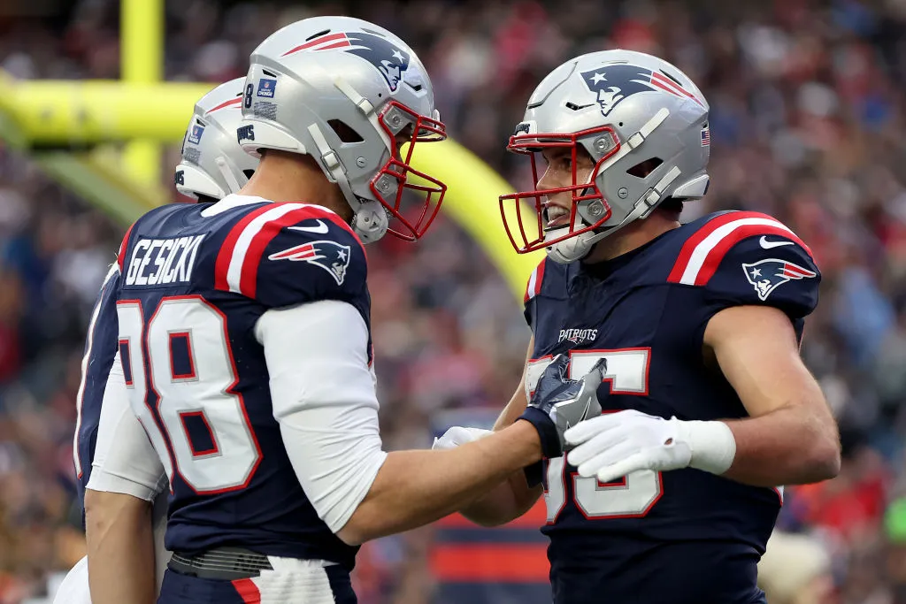 FOXBOROUGH, MASSACHUSETTS - DECEMBER 17: Mike Gesicki #88 and Hunter Henry #85 of the New England Patriots celebrate after Henry's receiving touchdown during the second quarter against the Kansas City Chiefs at Gillette Stadium on December 17, 2023 in Foxborough, Massachusetts. (Photo by Maddie Meyer/Getty Images)