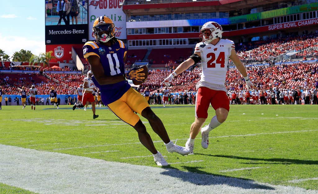 TAMPA, FLORIDA - JANUARY 01: Brian Thomas Jr. #11 of the LSU Tigers makes a catch during the ReliaQuest Bowl against the Wisconsin Badgers at Raymond James Stadium on January 01, 2024 in Tampa, Florida. (Photo by Mike Ehrmann/Getty Images)