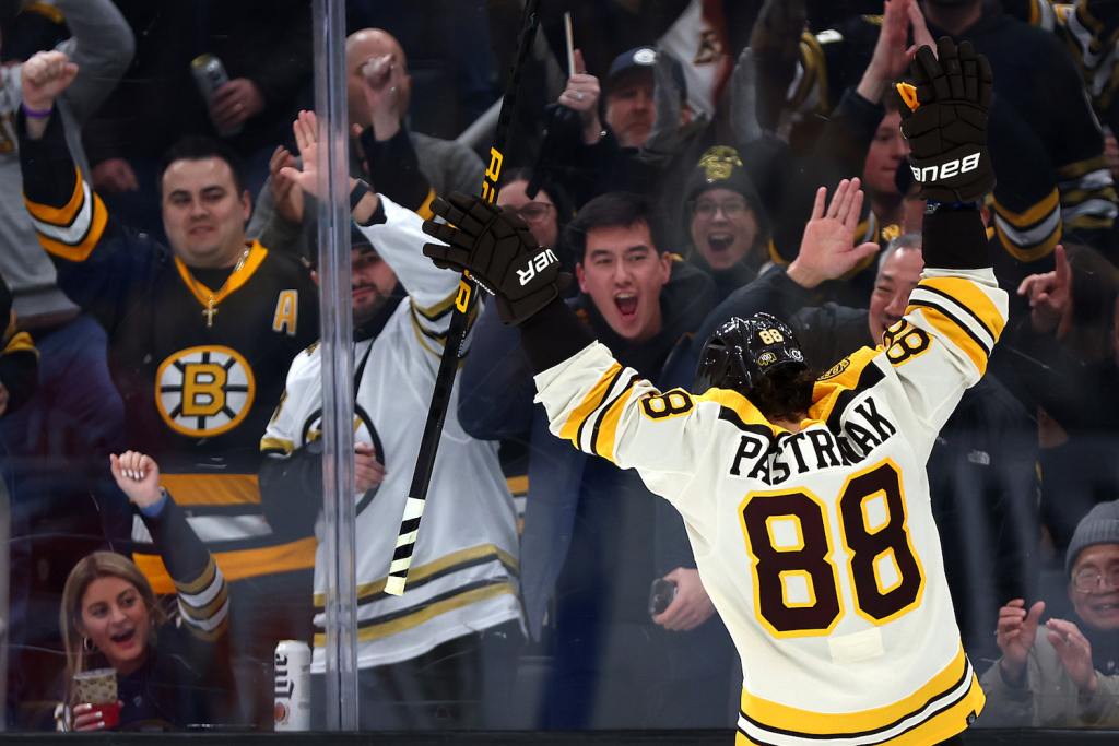 BOSTON, MASSACHUSETTS - JANUARY 20: David Pastrnak #88 of the Boston Bruins celebrates with fans after scoring a goal against the Montreal Canadiens during the third period at TD Garden on January 20, 2024 in Boston, Massachusetts. The Bruins defeat the Canadiens 9-4. (Photo by Maddie Meyer/Getty Images)