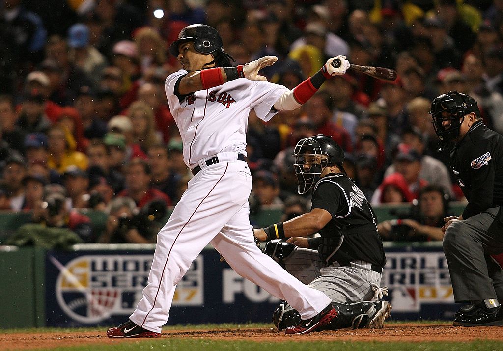 BOSTON - OCTOBER 24: Manny Ramirez #24 of the Boston Red Sox hits a sinlge against the Colorado Rockies during Game One of the 2007 Major League Baseball World Series at Fenway Park on October 24, 2007 in Boston, Massachusetts. (Photo by Nick Laham/Getty Images)