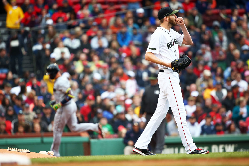 BOSTON, MA - MAY 27: Chris Sale #41 of the Boston Red Sox looks on as Tyler Flowers #25 of the Atlanta Braves rounds the bases after hitting a three-run home run in the second inning of a game at Fenway Park on May 27, 2018 in Boston, Massachusetts. (Photo by Adam Glanzman/Getty Images)