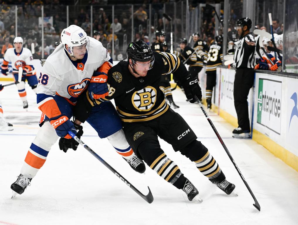 Nov 9, 2023; Boston, Massachusetts, USA; Boston Bruins center Patrick Brown (38) skates against New York Islanders defenseman Alexander Romanov (28) during the first period at the TD Garden. Mandatory Credit: Brian Fluharty-USA TODAY Sports