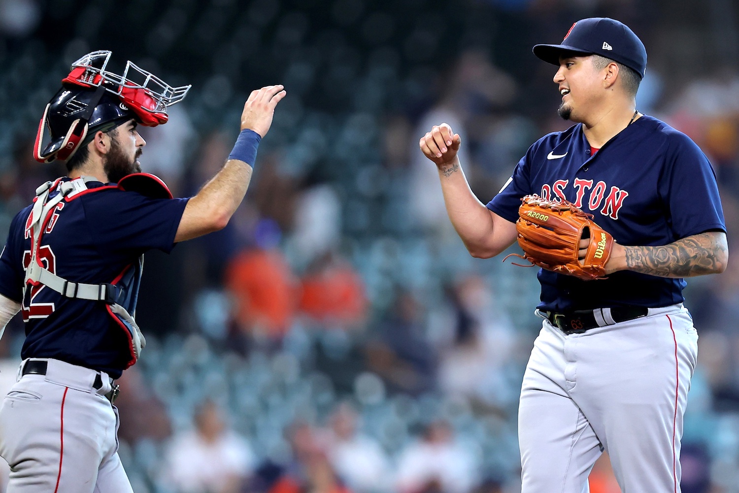 Aug 24, 2023; Houston, Texas, USA; Boston Red Sox catcher Connor Wong (12) congratulates Boston Red Sox relief pitcher Mauricio Llovera (68) following the final out against the Houston Astros during the ninth inning at Minute Maid Park. Mandatory Credit: Erik Williams-USA TODAY Sports