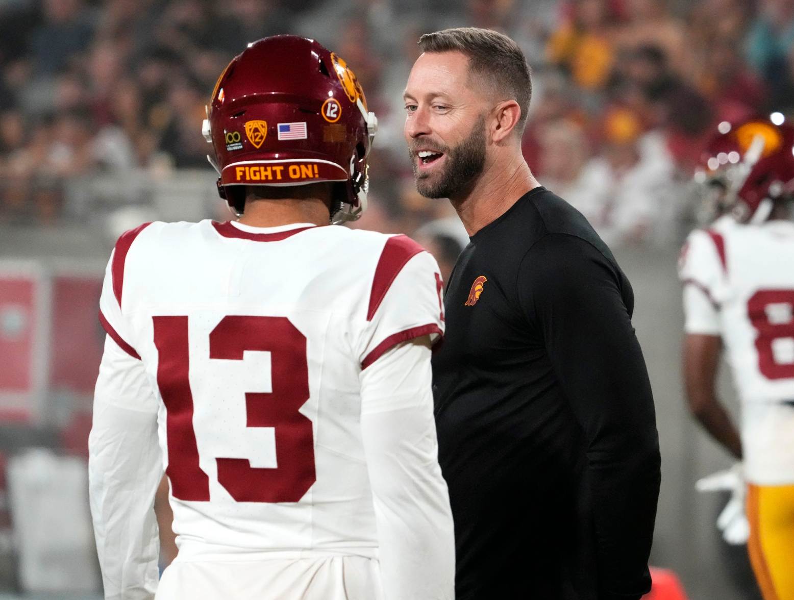 The former Arizona Cardinals head coach and now USC Trojans assistant coach Kliff Kingsbury talks to quarterback Caleb Williams (13) during the pregame warmup before playing the Arizona State Sun Devils at Mountain America Stadium in Tempe on Sept. 23, 2023. (Rob Schumacher/The Republic/USA Today Network)