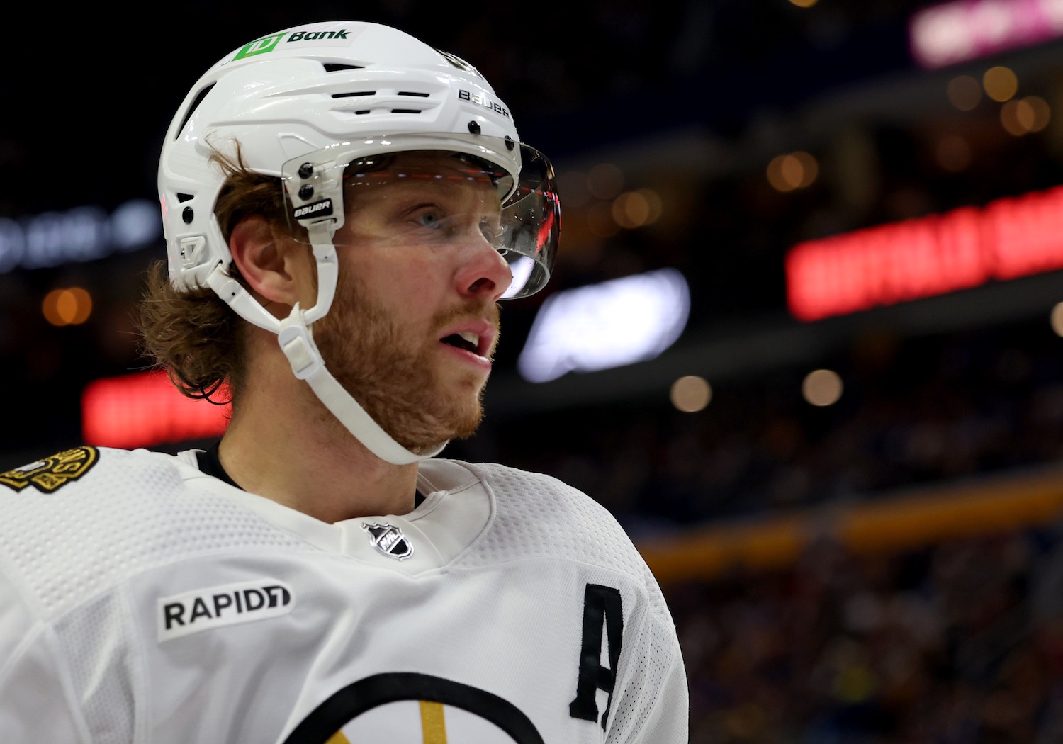 Dec 27, 2023; Buffalo, New York, USA; Boston Bruins right wing David Pastrnak (88) during a stoppage in play against the Buffalo Sabres during the first period at KeyBank Center. Mandatory Credit: Timothy T. Ludwig-USA TODAY Sports