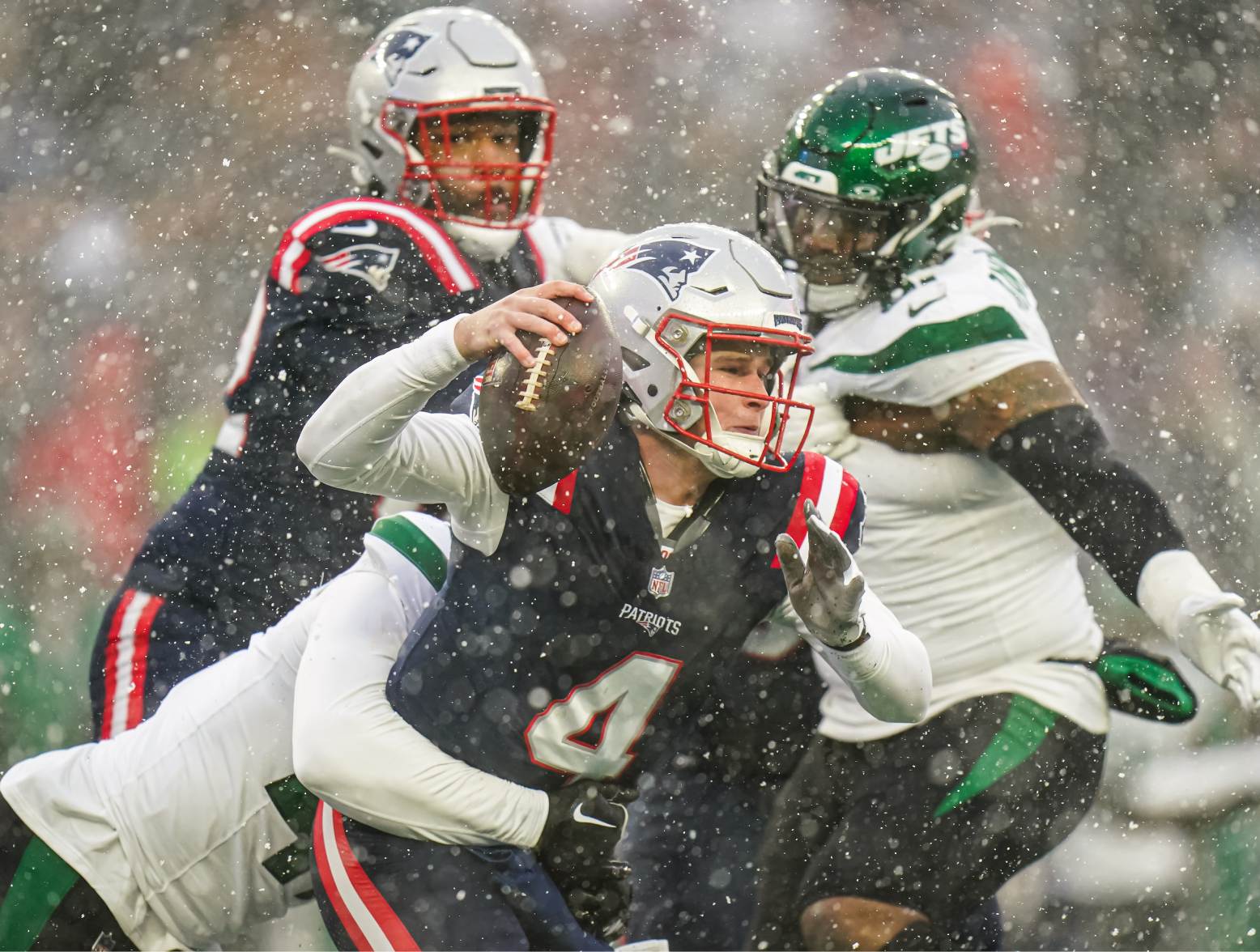 Jan 7, 2024; Foxborough, Massachusetts, USA; New England Patriots quarterback Bailey Zappe (4) is sacked by New York Jets linebacker Bryce Huff (47) in the first half at Gillette Stadium. Credit: David Butler II-USA TODAY Sports