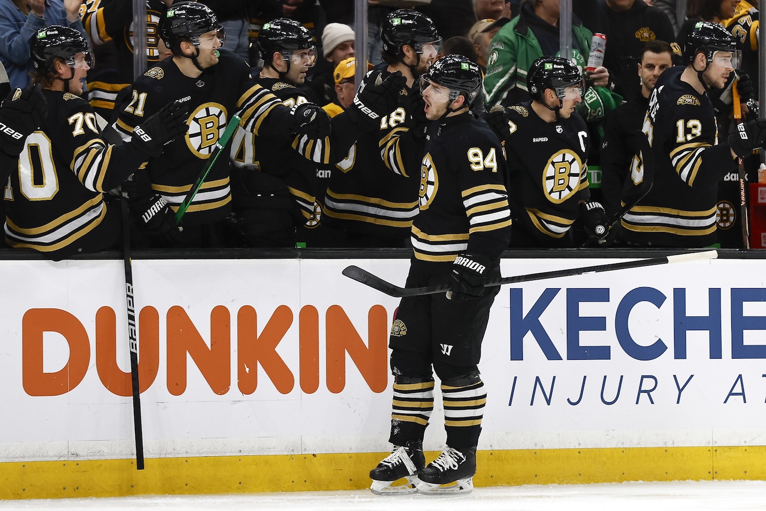 Jan 22, 2024; Boston, Massachusetts, USA; Boston Bruins center Jakub Lauko (94) is congratulated at the bench after scoring against the Winnipeg Jets during the first period at TD Garden. Mandatory Credit: Winslow Townson-USA TODAY Sports