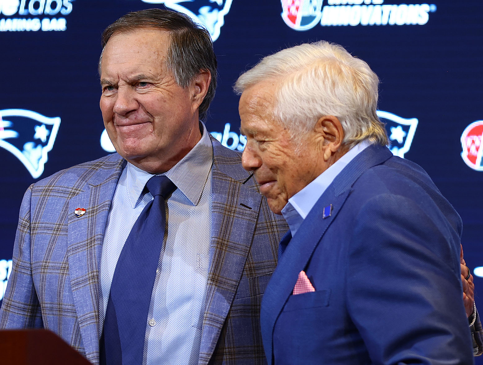 FOXBOROUGH, MASSACHUSETTS - JANUARY 11: Owner Robert Kraft (L) hugs head coach Bill Belichick (R) of the New England Patriots during a press conference at Gillette Stadium on January 11, 2024 in Foxborough, Massachusetts. Belichick announced he is stepping down as head coach after 24 seasons with the team. (Photo by Maddie Meyer/Getty Images)