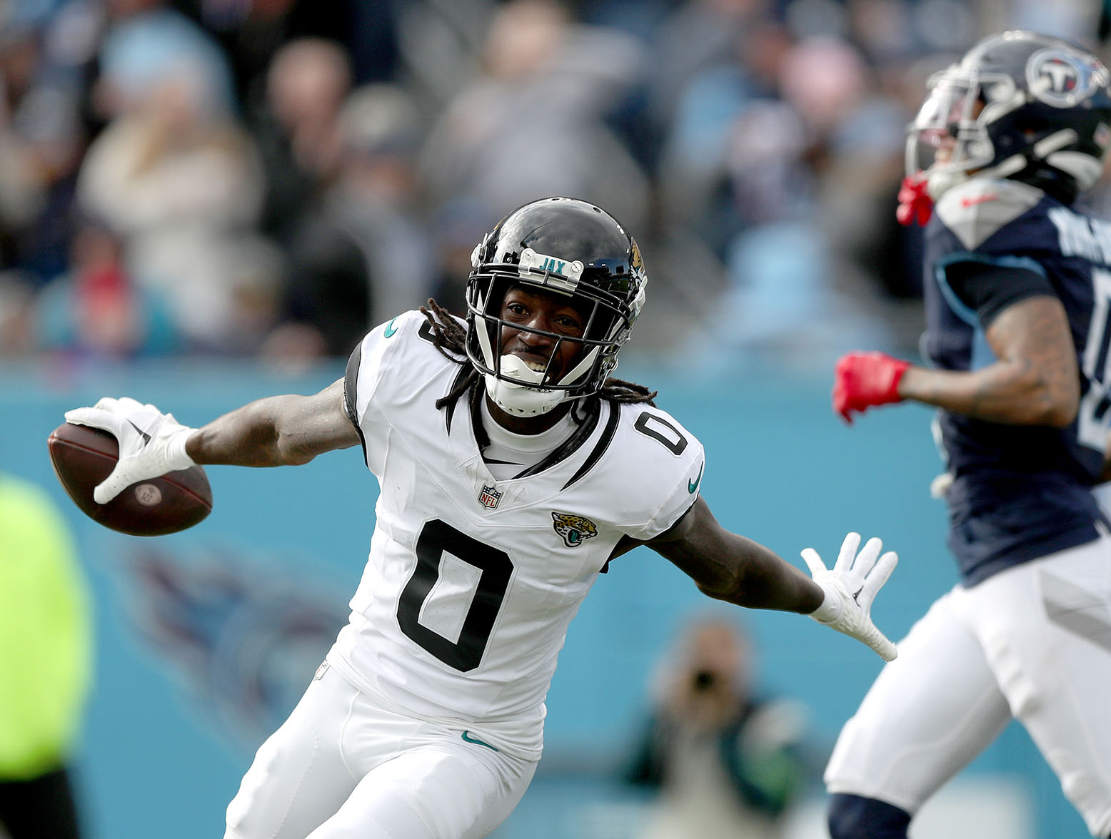 NASHVILLE, TENNESSEE - JANUARY 07: Calvin Ridley #0 of the Jacksonville Jaguars celebrates a touchdown catch during the first half against the Tennessee Titans at Nissan Stadium on January 07, 2024 in Nashville, Tennessee. (Photo by Justin Ford/Getty Images)