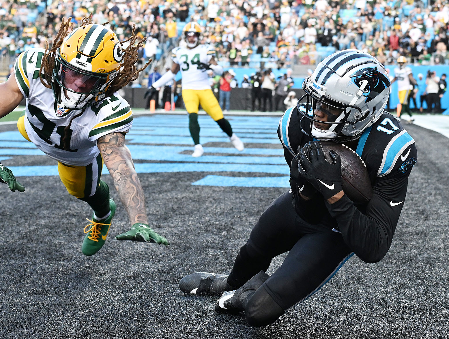 CHARLOTTE, NORTH CAROLINA - DECEMBER 24: DJ Chark Jr. #17 of the Carolina Panthers scores a touchdown to tie the game during the fourth quarter against the Green Bay Packers at Bank of America Stadium on December 24, 2023 in Charlotte, North Carolina. (Photo by Grant Halverson/Getty Images)