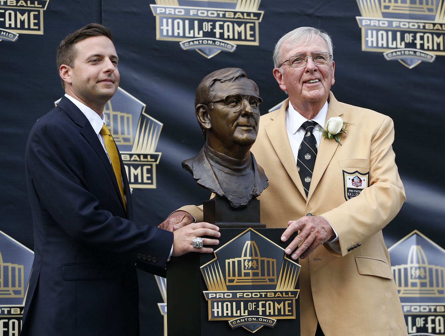 CANTON, OH - AUGUST 8: Ron Wolf and his son Eliot pose with Wolf's bust during the NFL Hall of Fame induction ceremony at Tom Benson Hall of Fame Stadium on August 8, 2015 in Canton, Ohio. (Photo by Joe Robbins/Getty Images)