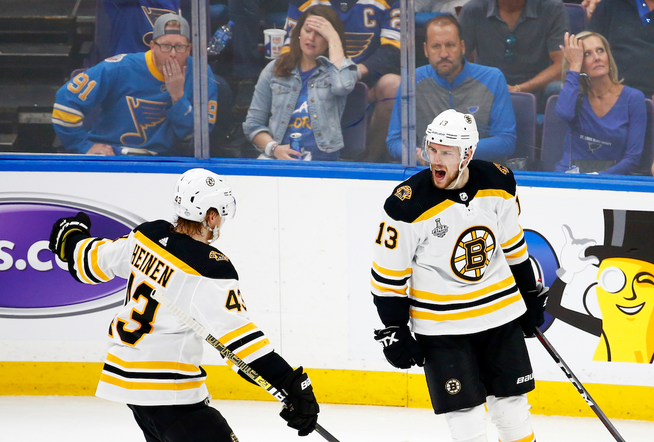 ST LOUIS, MISSOURI - JUNE 01: Charlie Coyle #13 of the Boston Bruins celebrates his first period goal with Danton Heinen #43 against the St. Louis Blues in Game Three of the 2019 NHL Stanley Cup Final at Enterprise Center on June 01, 2019 in St Louis, Missouri. (Photo by Dilip Vishwanat/Getty Images)