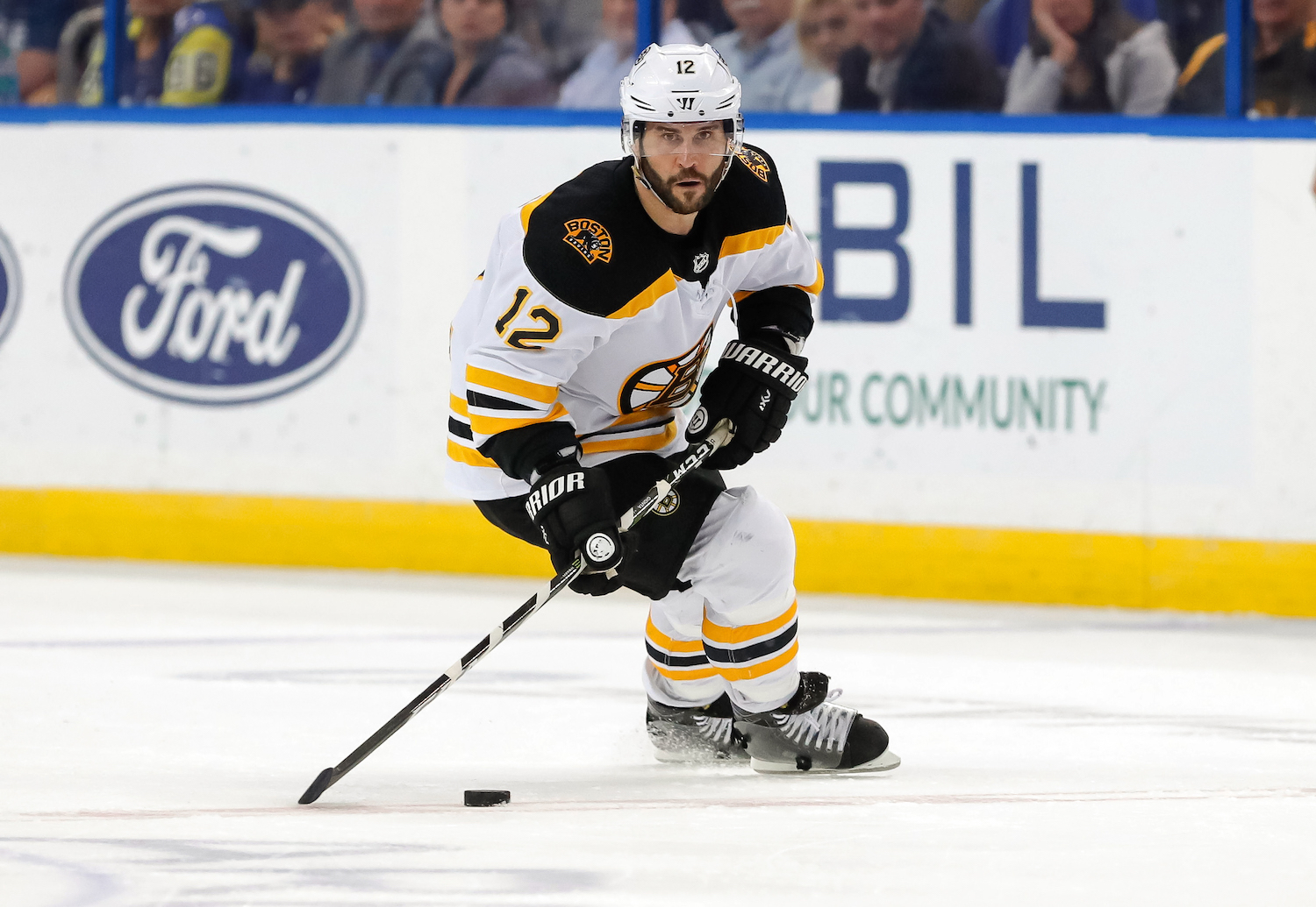 TAMPA, FL - APRIL 3: Brian Gionta #12 of the Boston Bruins brings the puck up against the Tampa Bay Lightning during the third period of the game at the Amalie Arena on April 3, 2018 in Tampa, Florida. (Photo by Mike Carlson/Getty Images) *** Local Caption *** Brian Gionta