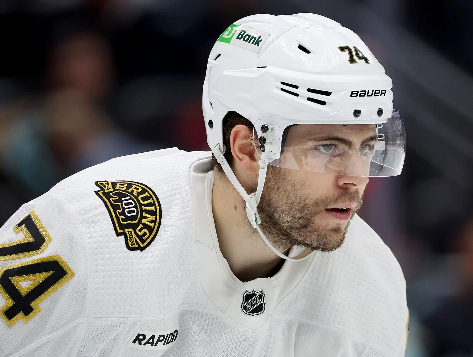 SEATTLE, WASHINGTON - FEBRUARY 26: Jake DeBrusk #74 of the Boston Bruins looks on during the second period against the Seattle Kraken at Climate Pledge Arena on February 26, 2024 in Seattle, Washington. (Photo by Steph Chambers/Getty Images)