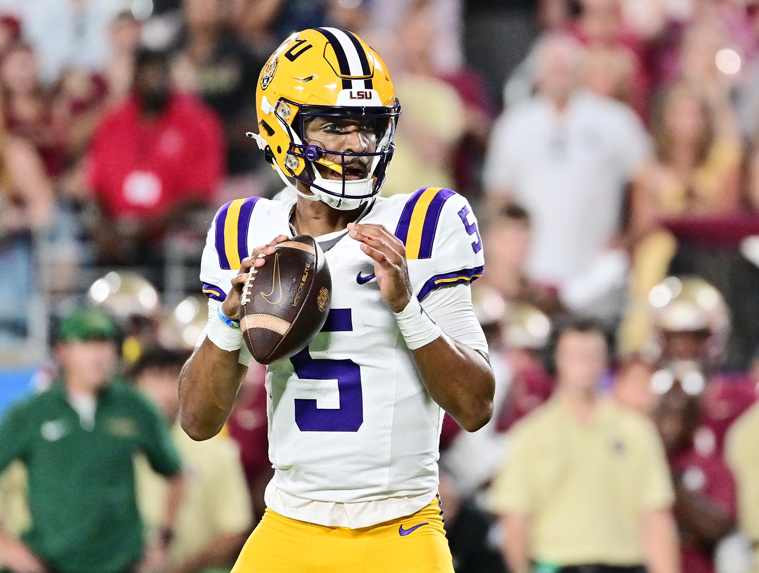 ORLANDO, FLORIDA - SEPTEMBER 03: Jayden Daniels #5 of the LSU Tigers looks to throw a pass in the first quarter against the Florida State Seminoles at Camping World Stadium on September 03, 2023 in Orlando, Florida. (Photo by Julio Aguilar/Getty Images)