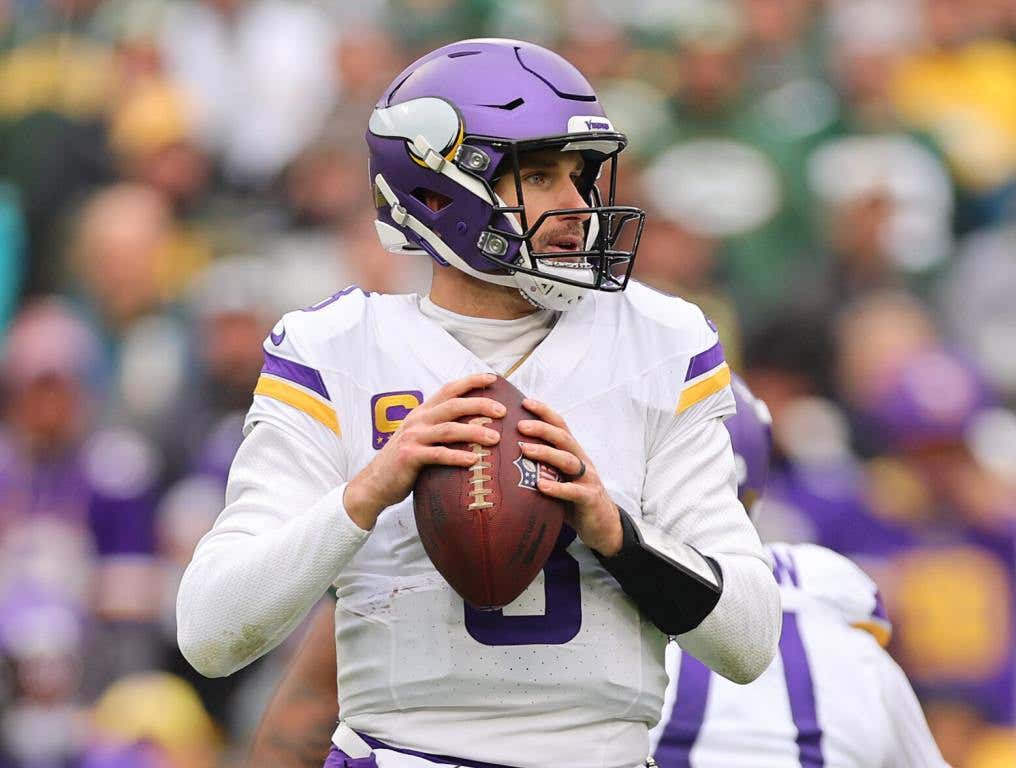 GREEN BAY, WISCONSIN - OCTOBER 29: Kirk Cousins #8 of the Minnesota Vikings looks to pass against the Green Bay Packers at Lambeau Field on October 29, 2023 in Green Bay, Wisconsin. (Photo by Michael Reaves/Getty Images)