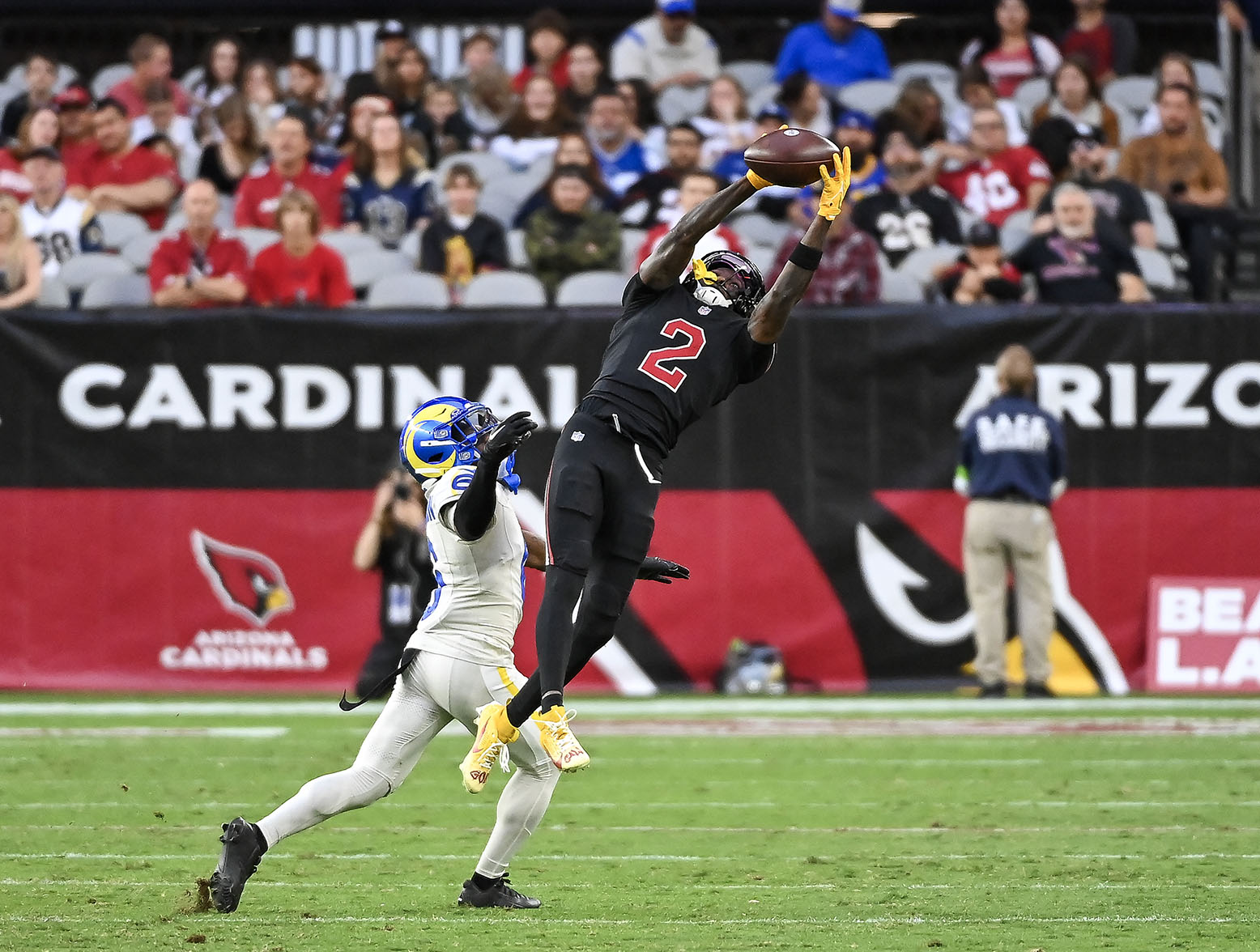 GLENDALE, ARIZONA - NOVEMBER 26: Marquise Brown #2 of the Arizona Cardinals catches a pass over Tre Tomlinson #6 of the Los Angeles Rams during the fourth quarter at State Farm Stadium on November 26, 2023 in Glendale, Arizona. (Photo by Norm Hall/Getty Images)