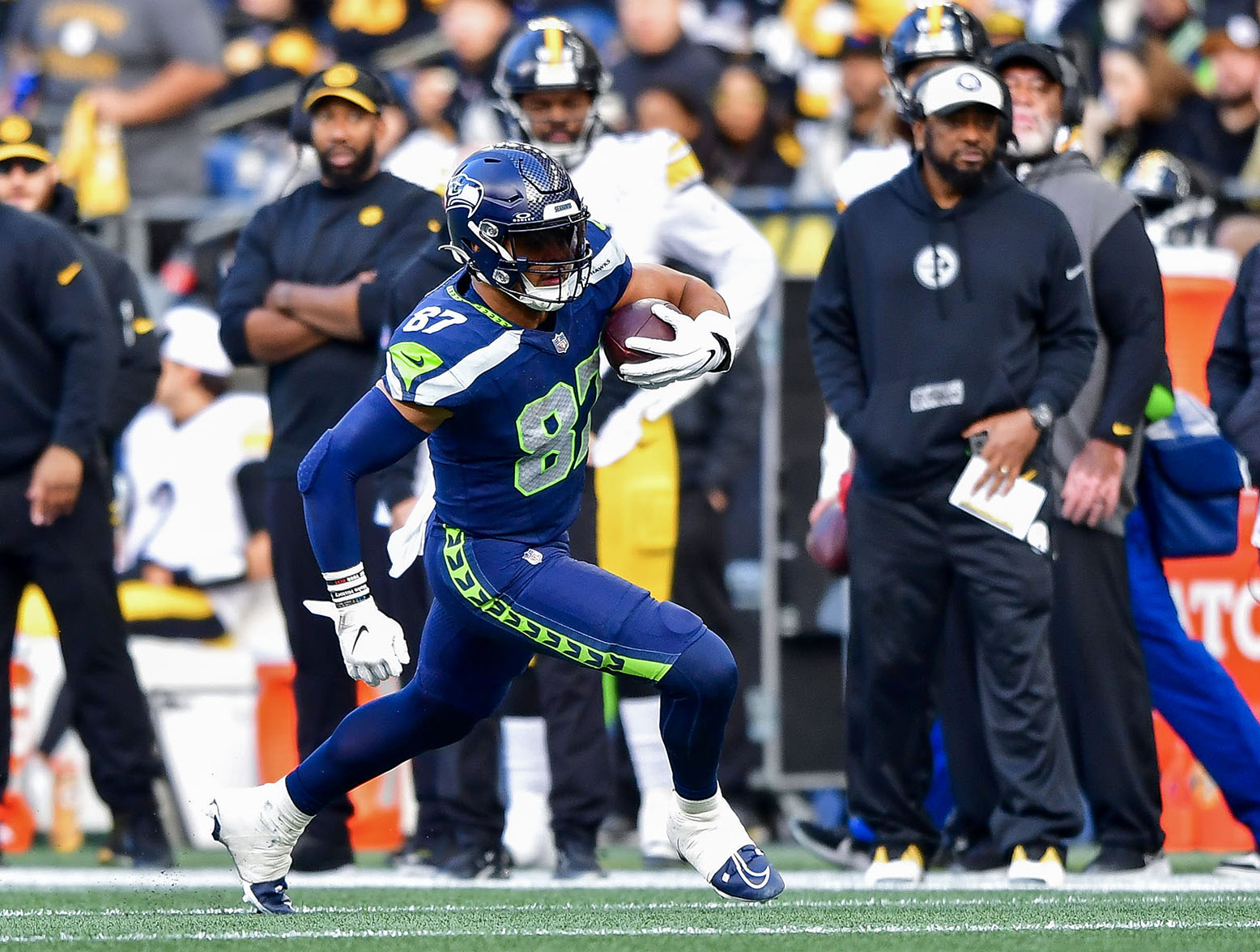 SEATTLE, WASHINGTON - DECEMBER 31: Noah Fant #87 of the Seattle Seahawks runs for a first down during the third quarter of a game against the Pittsburgh Steelers at Lumen Field on December 31, 2023 in Seattle, Washington. (Photo by Jane Gershovich/Getty Images)