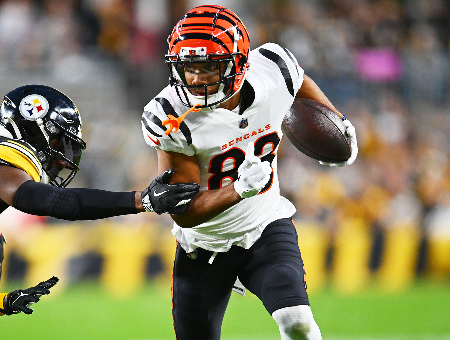 PITTSBURGH, PENNSYLVANIA - DECEMBER 23: Tyler Boyd #83 of the Cincinnati Bengals runs with the ball during the first quarter of a game against the Pittsburgh Steelers at Acrisure Stadium on December 23, 2023 in Pittsburgh, Pennsylvania. (Photo by Joe Sargent/Getty Images)