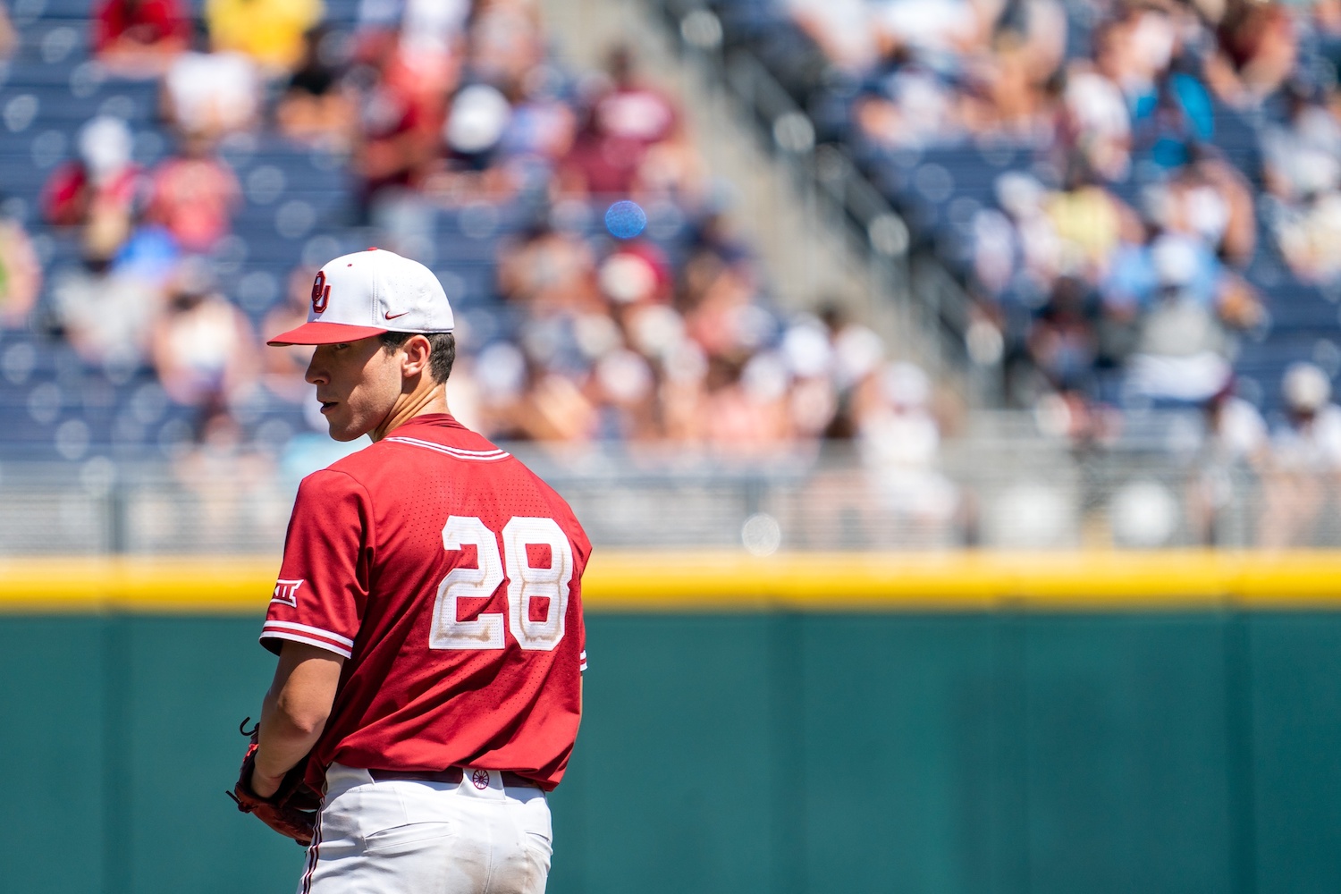 Jun 22, 2022; Omaha, NE, USA; Oklahoma Sooners starting pitcher David Sandlin (28) pitches against the Texas A&M Aggies during the seventh inning at Charles Schwab Field. Mandatory Credit: Dylan Widger-USA TODAY Sports