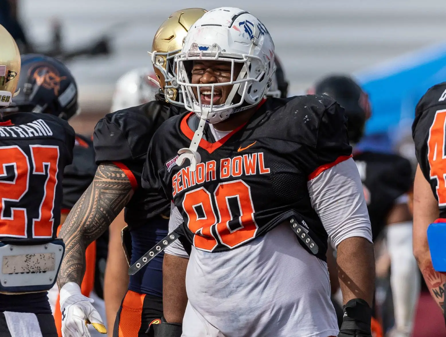 Feb 1, 2024; Mobile, AL, USA; National defensive lineman DeWayne Carter of Duke (90) grins after breaking from a team gathering during practice for the National team at Hancock Whitney Stadium. Credit: Vasha Hunt-USA TODAY Sports