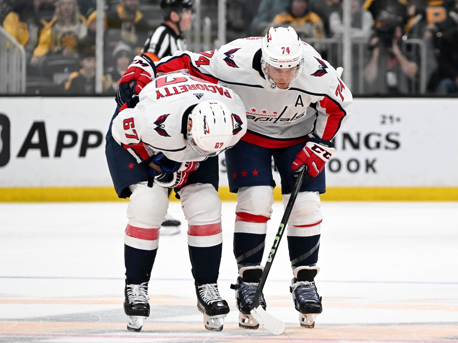 Feb 10, 2024; Boston, Massachusetts, USA; Washington Capitals defenseman John Carlson (74) helps left wing Max Pacioretty (67) off of the ice after being speared by defenseman Matt Grzelcyk (not seen) during the first period at the TD Garden. Grzelcyk received a game misconduct. Mandatory Credit: Brian Fluharty-USA TODAY Sports