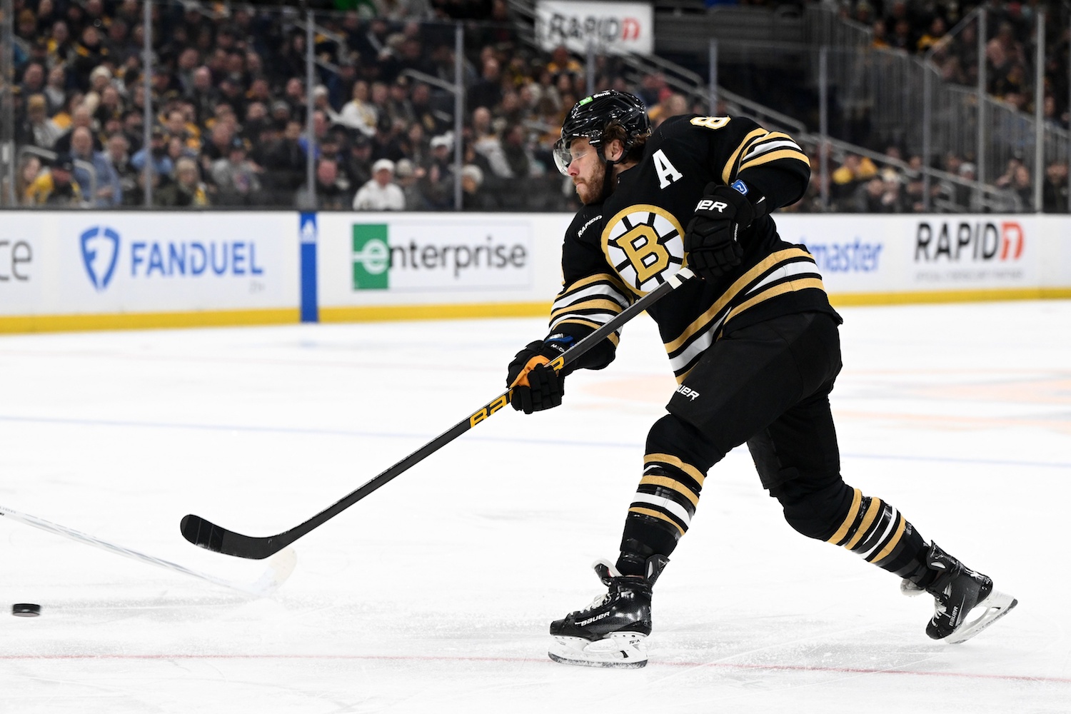 Feb 15, 2024; Boston, Massachusetts, USA; Boston Bruins right wing David Pastrnak (88) takes a shot against the Seattle Kraken during the first period at TD Garden. Mandatory Credit: Brian Fluharty-USA TODAY Sports