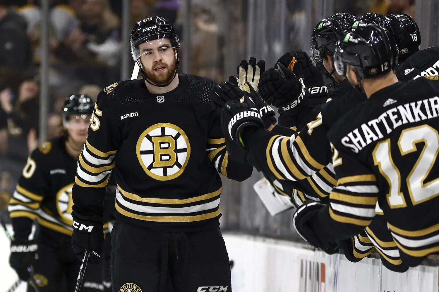 Feb 19, 2024; Boston, Massachusetts, USA; Boston Bruins right wing Justin Brazeau (55) is congratulated at the bench after scoring his first NHL goal during the second period against the Dallas Stars at TD Garden. Mandatory Credit: Winslow Townson-USA TODAY Sports