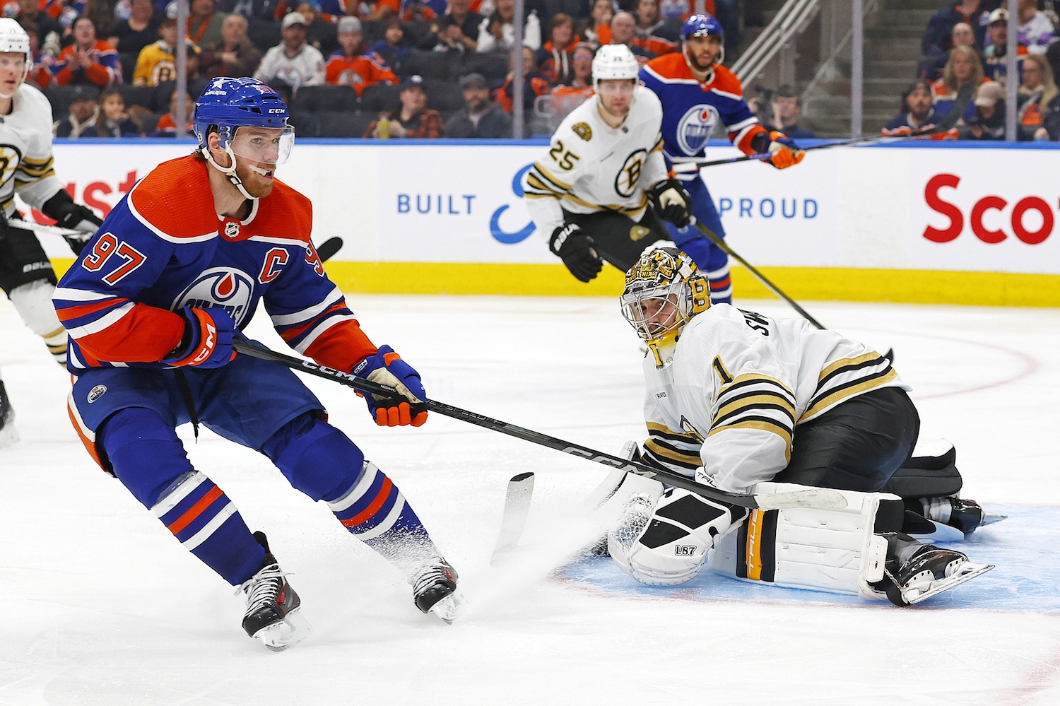 Feb 21, 2024; Edmonton, Alberta, CAN; Boston Bruins goaltender Jeremy Swayman (1) makes a save on  on Edmonton Oilers forward Connor McDavid (97) during the third period at Rogers Place. Mandatory Credit: Perry Nelson-USA TODAY Sports