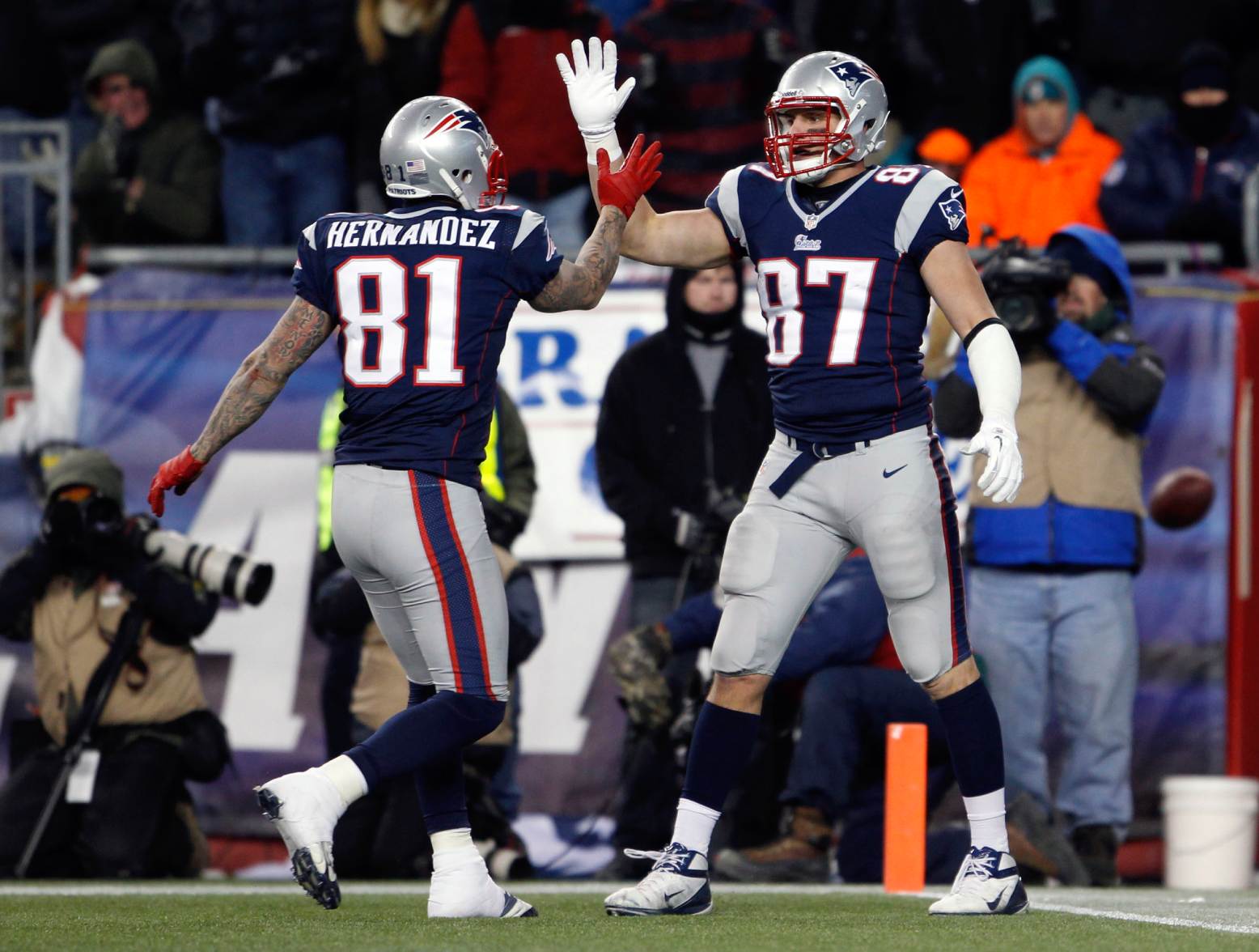 Dec 30, 2012; Foxborough, MA, USA; New England Patriots tight end Rob Gronkowski (87) is congratulated by tight end Aaron Hernandez (81) after his touchdown against the Miami Dolphins during the second half at Gillette Stadium. The New England Patriots defeated the Miami Dolphins 28-0. Credit: David Butler II-USA TODAY Sports