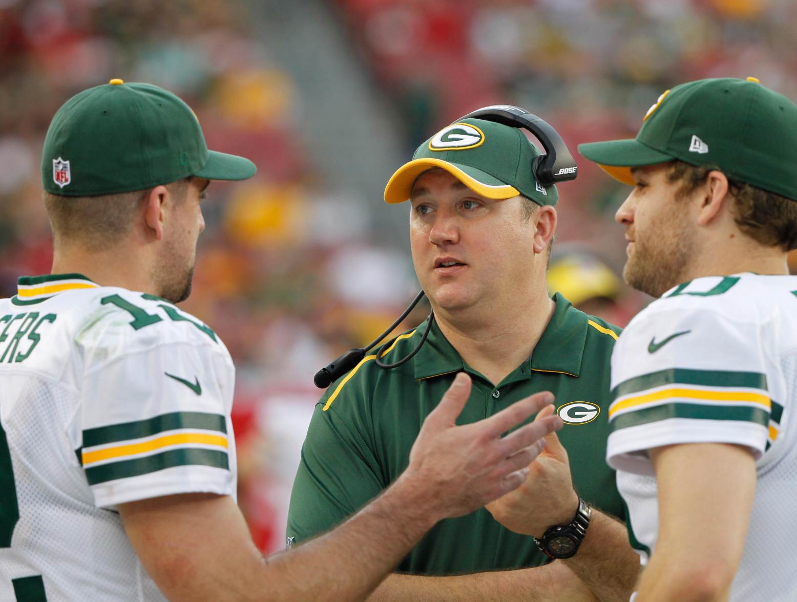 Dec 21, 2014; Tampa, FL, USA; Green Bay Packers quarterback Aaron Rodgers (12), quarterbacks coach Alex Van Pelt  and quarterback Matt Flynn (10) talk during the second half against the Tampa Bay Buccaneers at Raymond James Stadium. Green Bay Packers defeated the Tampa Bay Buccaneers 20-3. Credit: Kim Klement-USA TODAY Sports