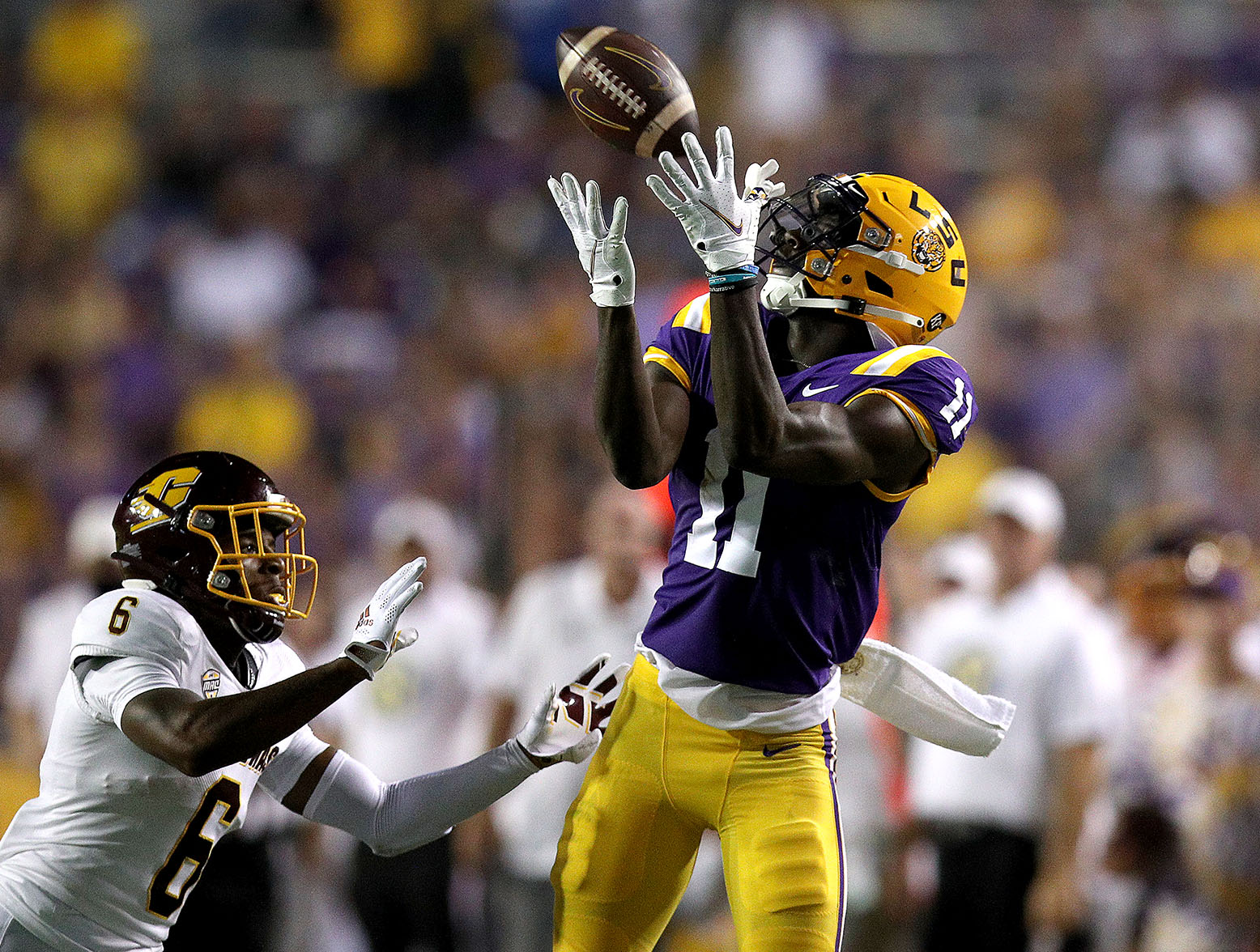 BATON ROUGE, LOUISIANA - SEPTEMBER 18: Brian Thomas Jr. #11 of the LSU Tigers catches a pass over Daedae Hill #6 of the Central Michigan Chippewas during the second quarter at Tiger Stadium on September 18, 2021 in Baton Rouge, Louisiana. (Photo by Sean Gardner/Getty Images)