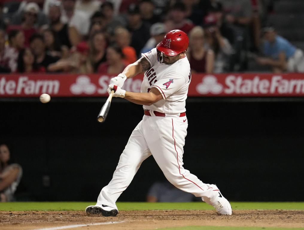 ANAHEIM, CALIFORNIA - AUGUST 3: Mike Moustakas #8 of the Los Angeles Angels hits an RBI double to score C.J. Cron #25 during the sixth inning against the Seattle Mariners at Angel Stadium of Anaheim on August 3, 2023 in Anaheim, California. (Photo by Kevork Djansezian/Getty Images)