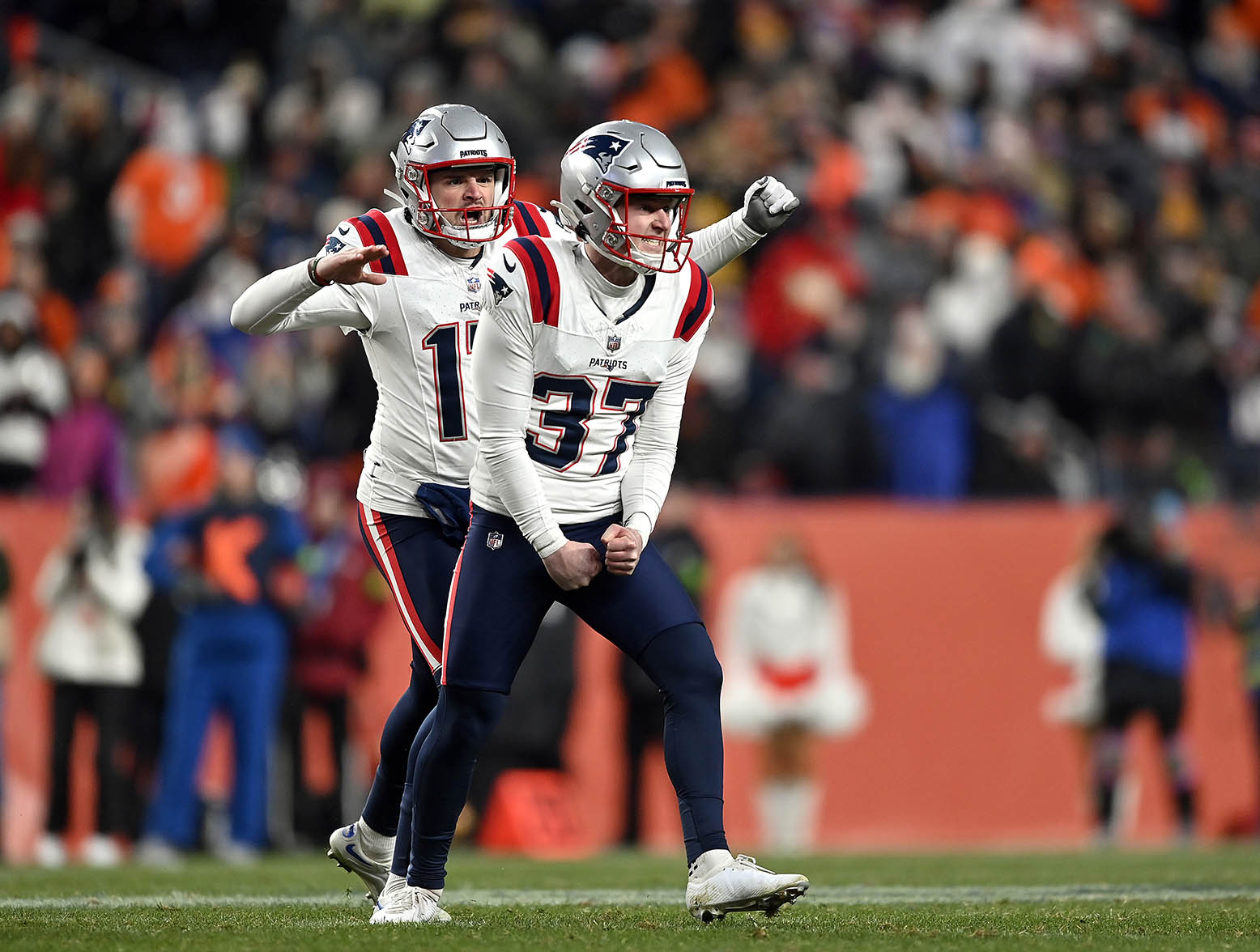DENVER, COLORADO - DECEMBER 24: Place kicker Chad Ryland #37 of the New England Patriots celebrates with punter Bryce Baringer #17 after kicking a field goal in the final seconds of the 4th quarter of the game against the Denver Broncos at Empower Field At Mile High on December 24, 2023 in Denver, Colorado. (Photo by Dustin Bradford/Getty Images)