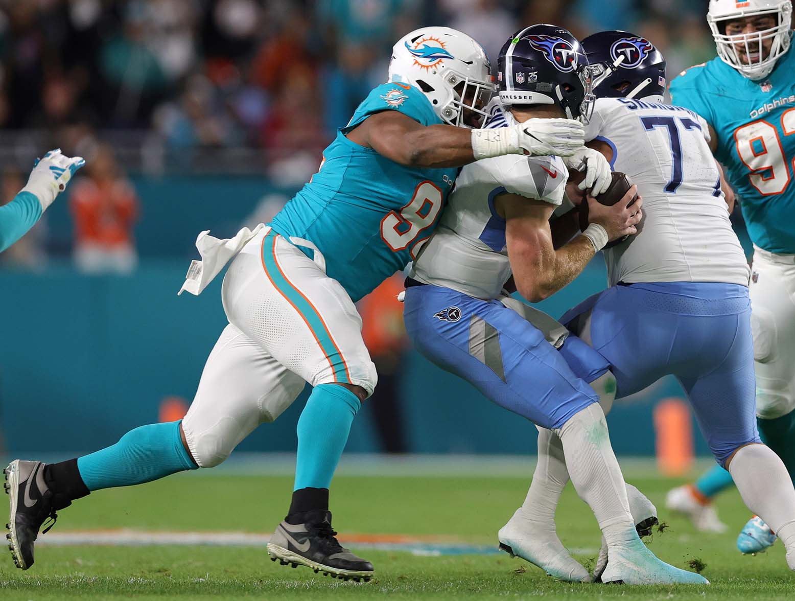 MIAMI GARDENS, FLORIDA - DECEMBER 11: Christian Wilkins #94 of the Miami Dolphins sacks Will Levis #8 of the Tennessee Titans in the first quarter at Hard Rock Stadium on December 11, 2023 in Miami Gardens, Florida. (Photo by Megan Briggs/Getty Images)