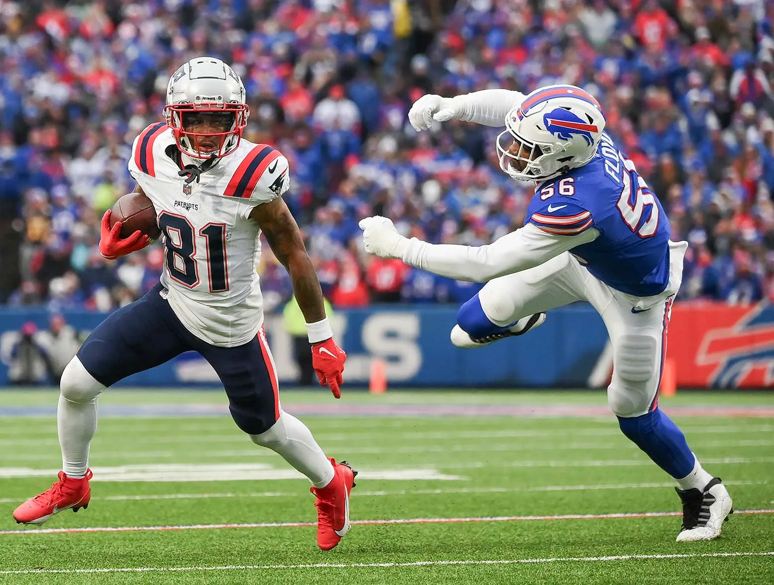 ORCHARD PARK, NEW YORK - DECEMBER 31: DeMario Douglas #81 of the New England Patriots runs with the ball during the second half of a game against the Buffalo Bills at Highmark Stadium on December 31, 2023 in Orchard Park, New York. (Photo by Rich Barnes/Getty Images)