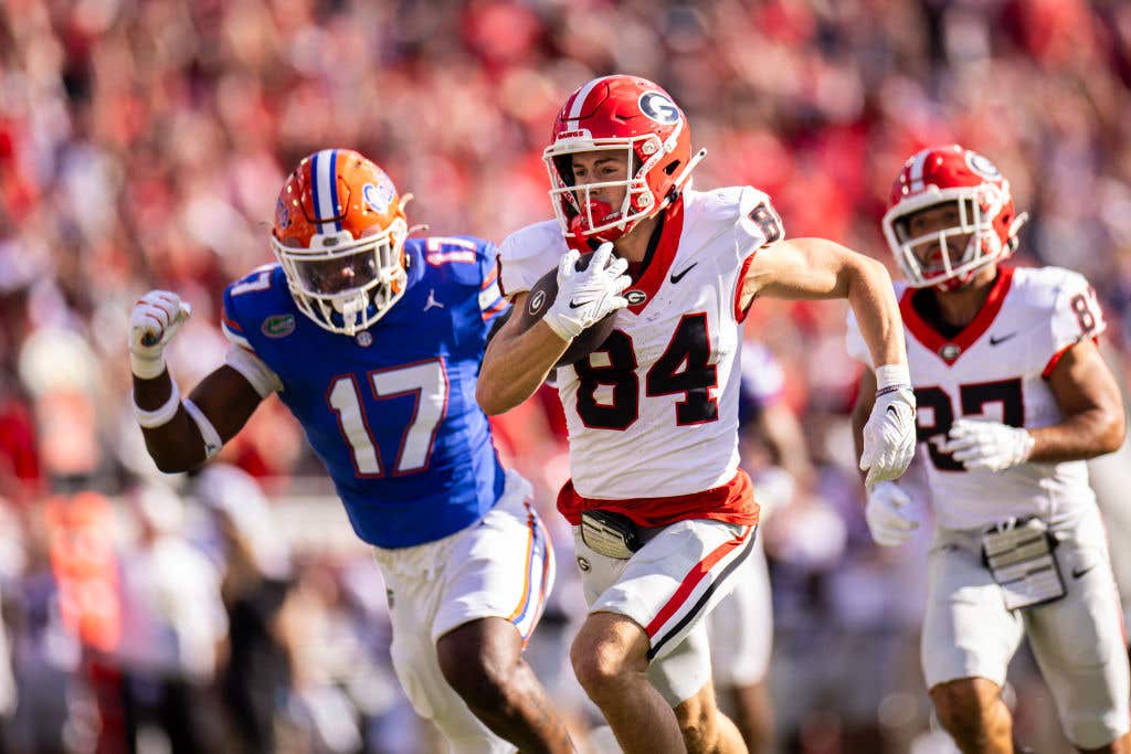 JACKSONVILLE, FLORIDA - OCTOBER 28: Ladd McConkey #84 of the Georgia Bulldogs scores a touchdown during the first half of a game against the Florida Gators at EverBank Stadium on October 28, 2023 in Jacksonville, Florida. (Photo by James Gilbert/Getty Images)