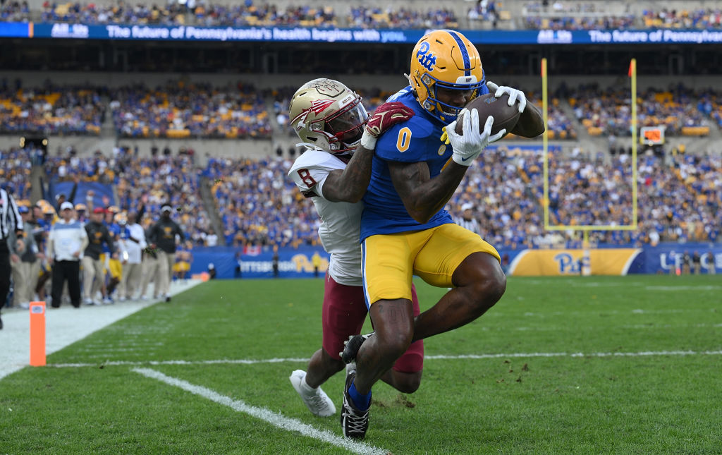 PITTSBURGH, PENNSYLVANIA - NOVEMBER 4: Bub Means #0 of the Pittsburgh Panthers makes a catch in front of Renardo Green #8 of the Florida State Seminoles for a 9-yard touchdown reception in the second quarter during the game at Acrisure Stadium on November 4, 2023 in Pittsburgh, Pennsylvania. (Photo by Justin Berl/Getty Images)