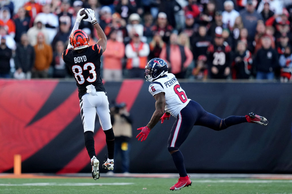 CINCINNATI, OHIO - NOVEMBER 12: Tyler Boyd #83 of the Cincinnati Bengals catches a pass against Denzel Perryman #6 of the Houston Texans during the fourth quarter at Paycor Stadium on November 12, 2023 in Cincinnati, Ohio. (Photo by Dylan Buell/Getty Images)
