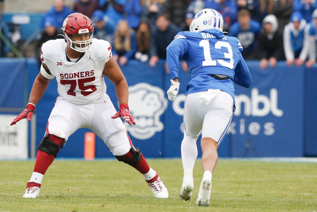 PROVO, UT - NOVEMBER 18: Walter Rouse #75 of the Oklahoma Sooners blocks Isaiah Bagnah #13 of the Brigham Young Cougars during the first half of their game at LaVell Edwards Stadium on November 18, 2023 in Provo, Utah. (Photo by Chris Gardner/Getty Images)
