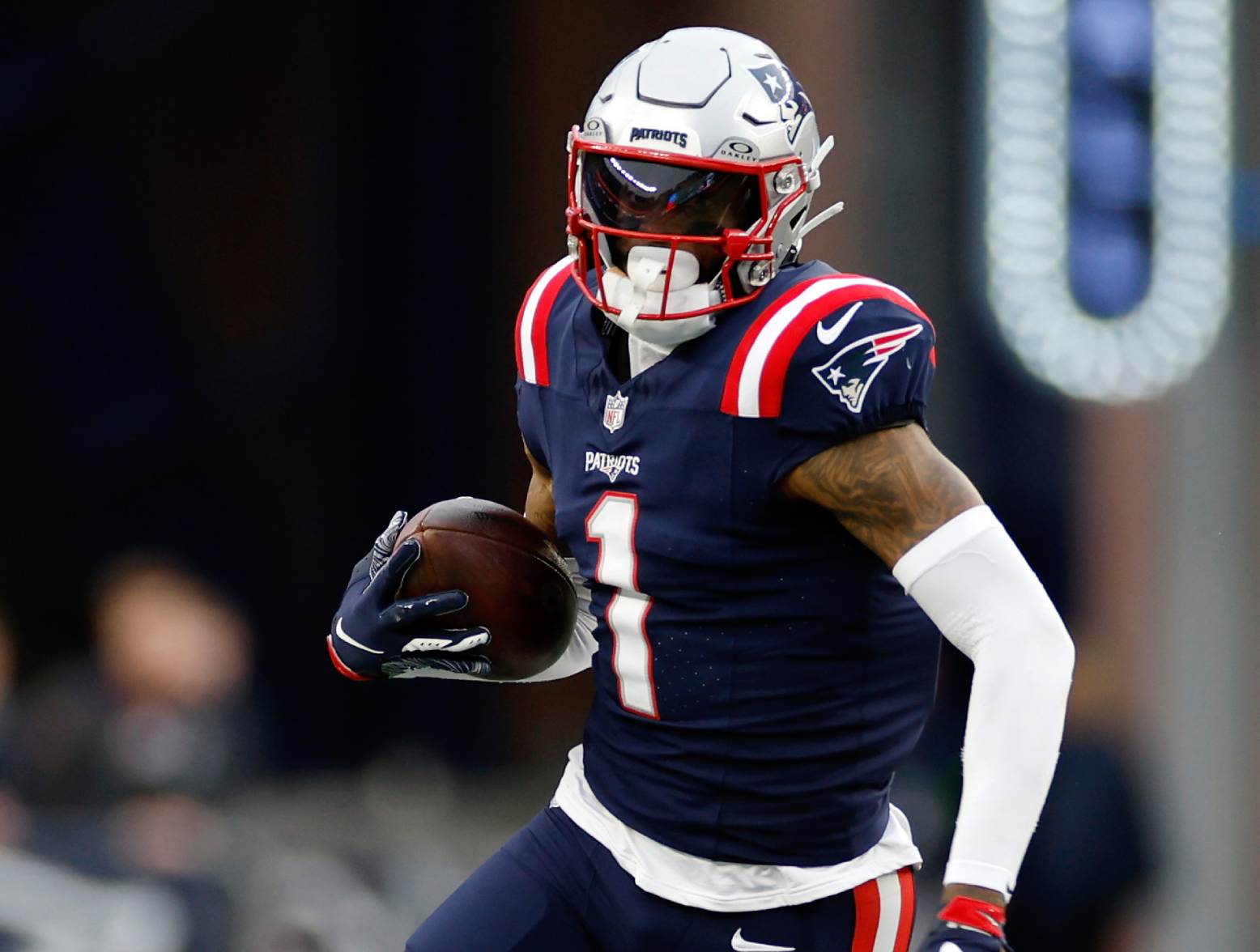 FOXBOROUGH, MASSACHUSETTS - DECEMBER 17: DeVante Parker #1 of the New England Patriots carries the ball during the game against the Kansas City Chiefs at Gillette Stadium on December 17, 2023 in Foxborough, Massachusetts. (Photo by Sarah Stier/Getty Images)