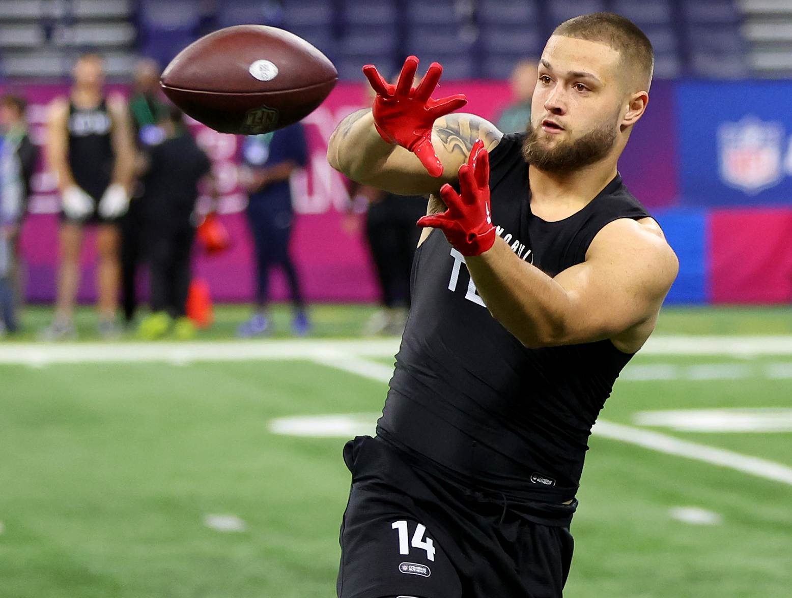 INDIANAPOLIS, INDIANA - MARCH 01: Cade Stover #TE14 of Ohio State participates in a drill during the NFL Combine at Lucas Oil Stadium on March 01, 2024 in Indianapolis, Indiana. (Photo by Stacy Revere/Getty Images)