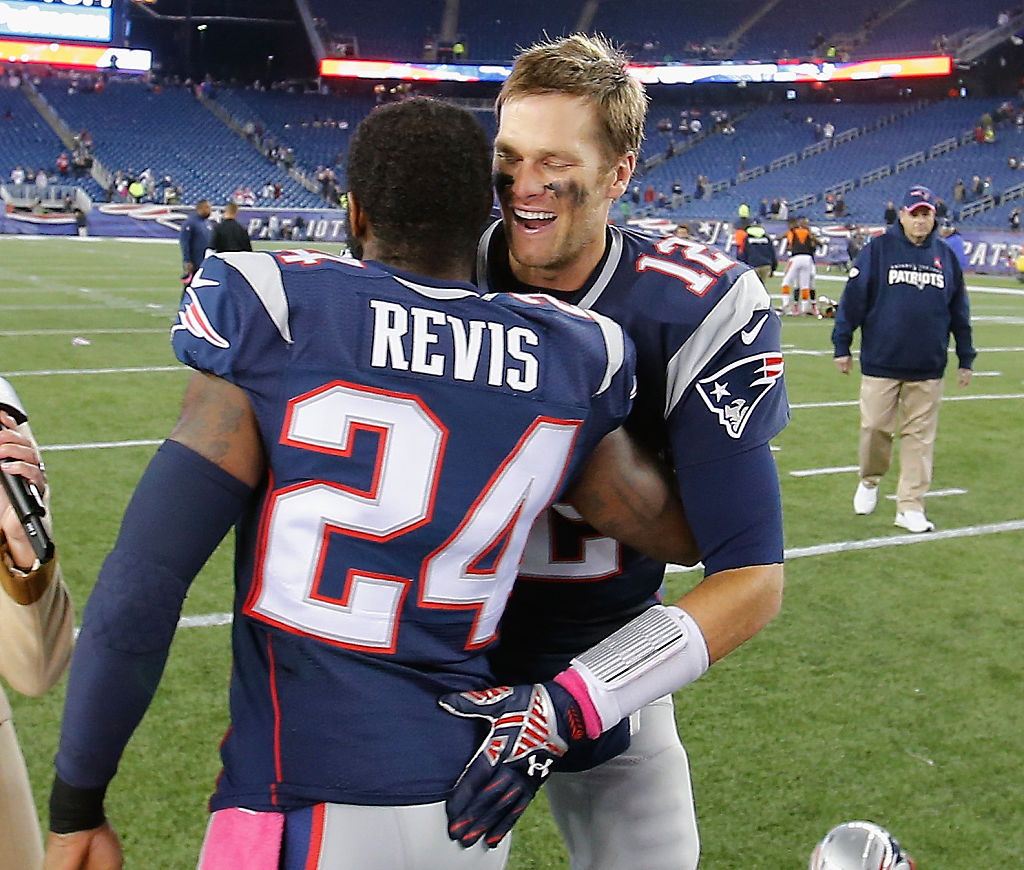 FOXBORO, MA - OCTOBER 05:  Darrelle Revis #24 and Tom Brady #12 of the New England Patriots hug after playing the Cincinnati Bengals at Gillette Stadium on October 5, 2014 in Foxboro, Massachusetts.  (Photo by Jim Rogash/Getty Images)
