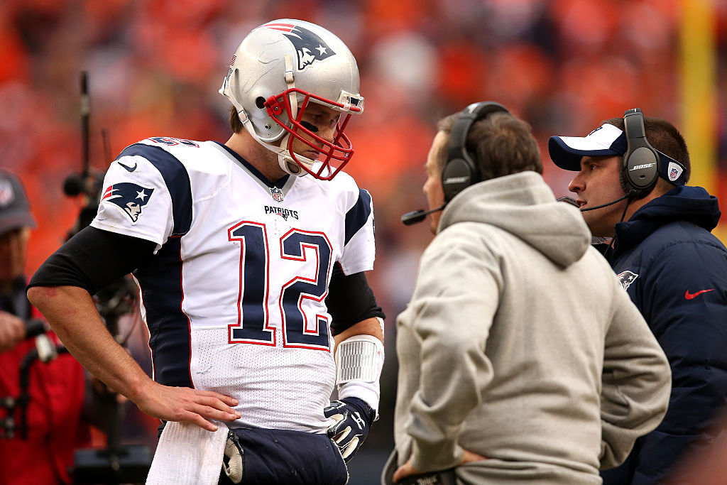 DENVER, CO - JANUARY 24: Tom Brady #12 of the New England Patriots speaks to head coach Bill Belichick in the fourth quarter against the Denver Broncos in the AFC Championship game at Sports Authority Field at Mile High on January 24, 2016 in Denver, Colorado.  (Photo by Doug Pensinger/Getty Images)