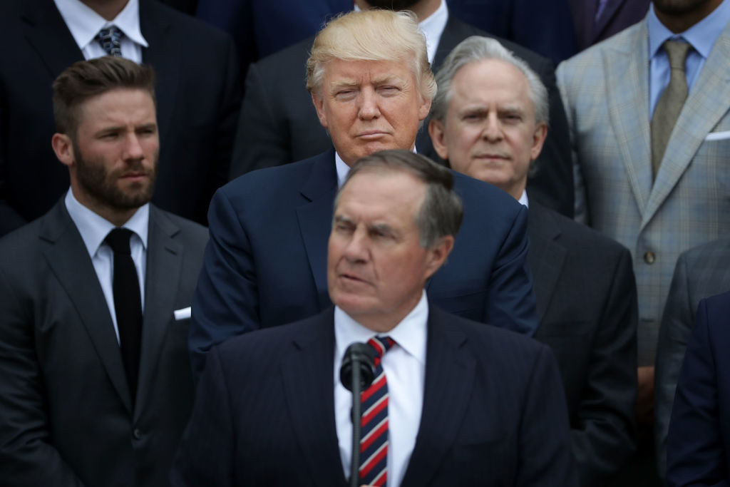 WASHINGTON, DC - APRIL 19:  U.S. President Donald Trump (C) listens to New England Patriots Head Coach Bill Belichick deliver remarks during an event celebrating the team's Super Bowl win on the South Lawn at the White House April 19, 2017 in Washington, DC. It was the team's fifth Super Bowl victory since 1960.  (Photo by Chip Somodevilla/Getty Images)