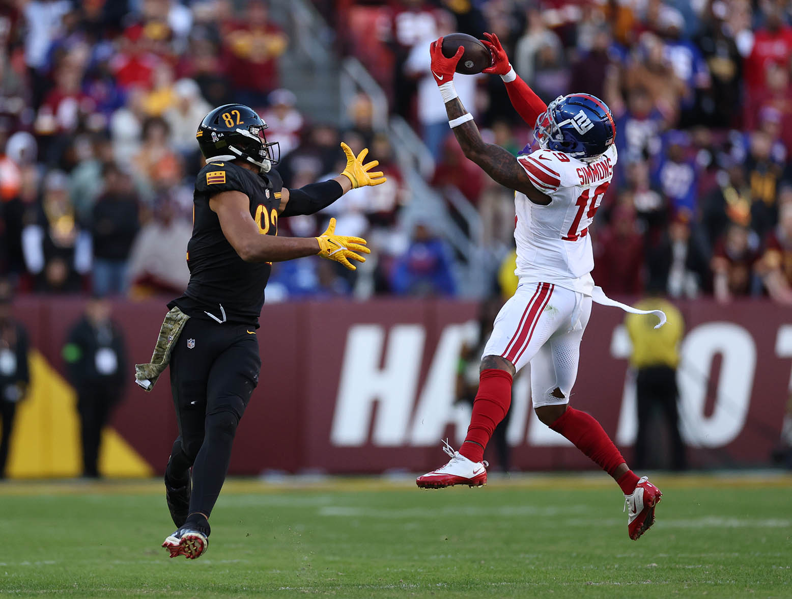 LANDOVER, MARYLAND - NOVEMBER 19: Isaiah Simmons #19 of the New York Giants makes an interceptions and returns it for a touchdown during the fourth quarter in the game against the Washington Commanders at FedExField on November 19, 2023 in Landover, Maryland. (Photo by Patrick Smith/Getty Images)