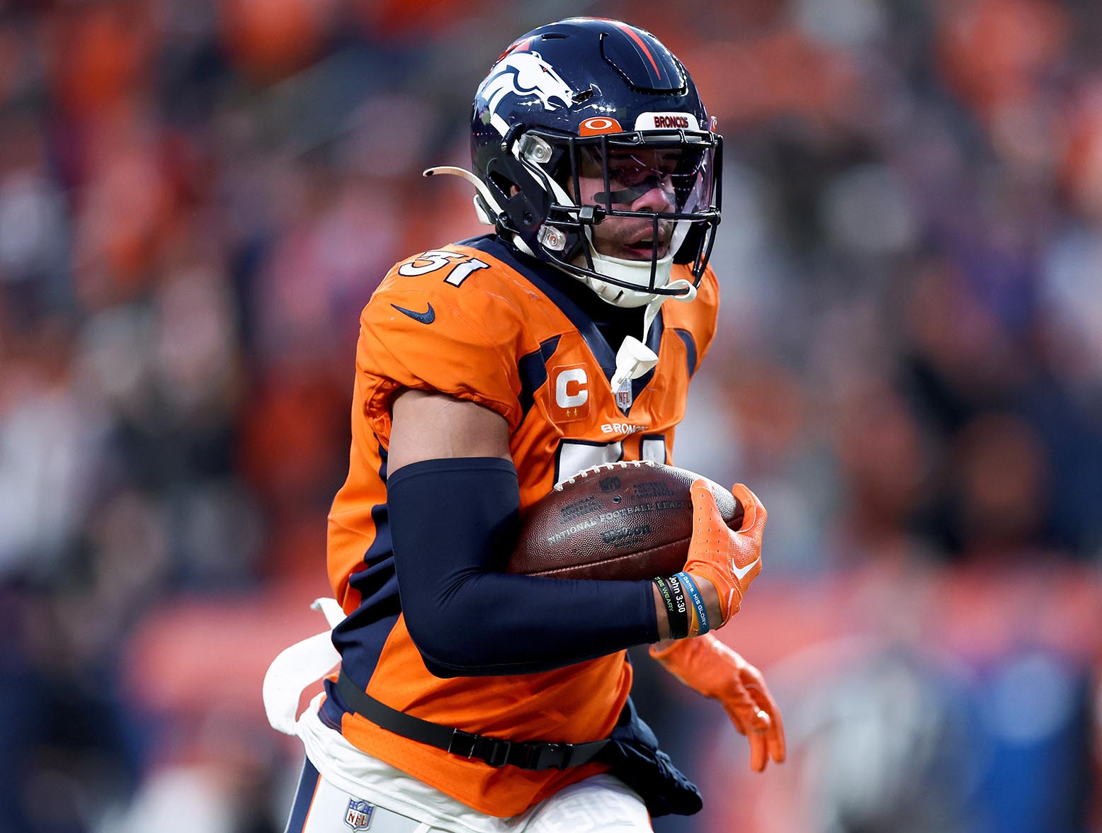 DENVER, COLORADO - DECEMBER 18: Justin Simmons #31 of the Denver Broncos carries the ball after an interception against the Arizona Cardinals during the third quarter of the game at Empower Field At Mile High on December 18, 2022 in Denver, Colorado. (Photo by Matthew Stockman/Getty Images)